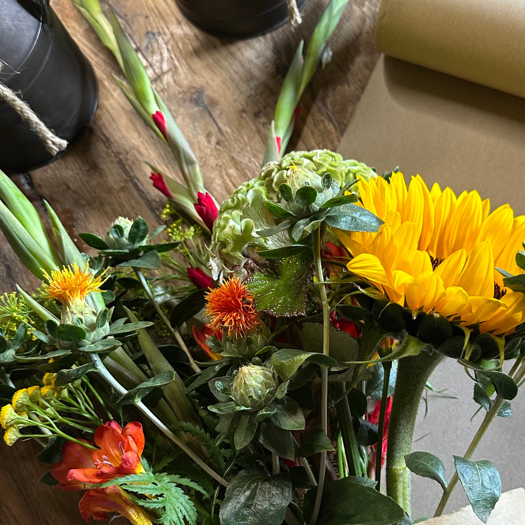 Bouquet of colorful flowers on a wooden surface