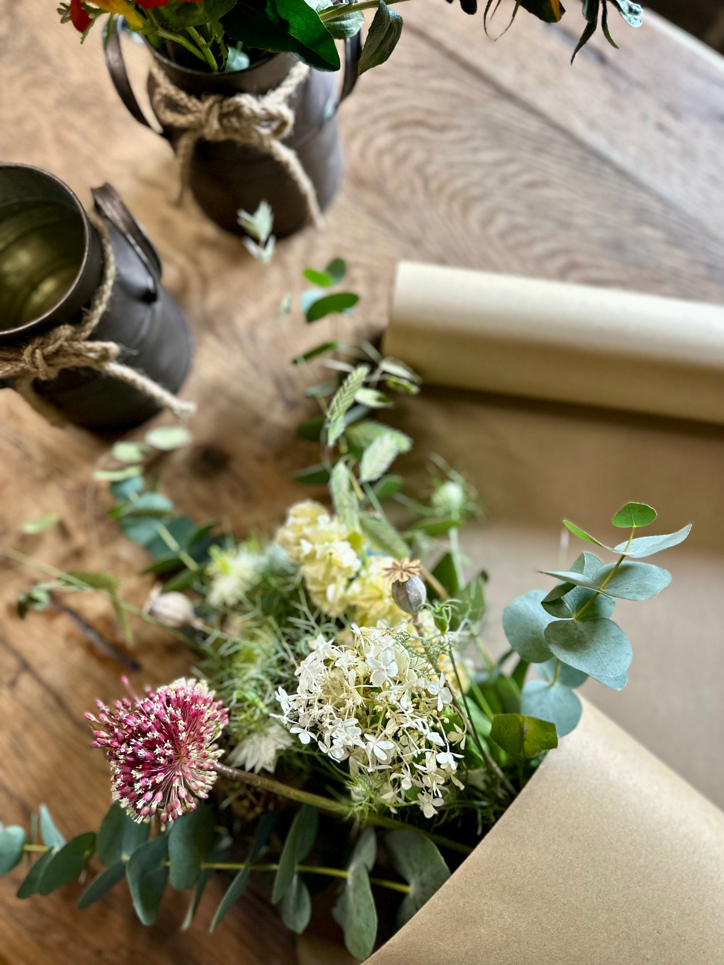 Decorative floral arrangement on a wooden surface with  decorative elements.